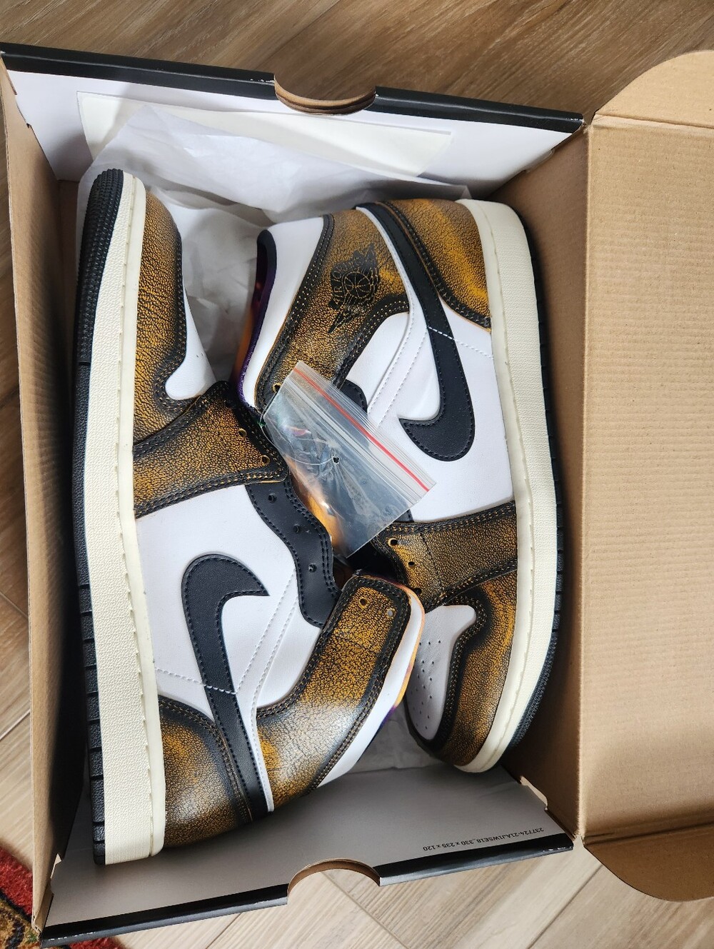 Jordan Low Sneakers in White, Black and Gold
